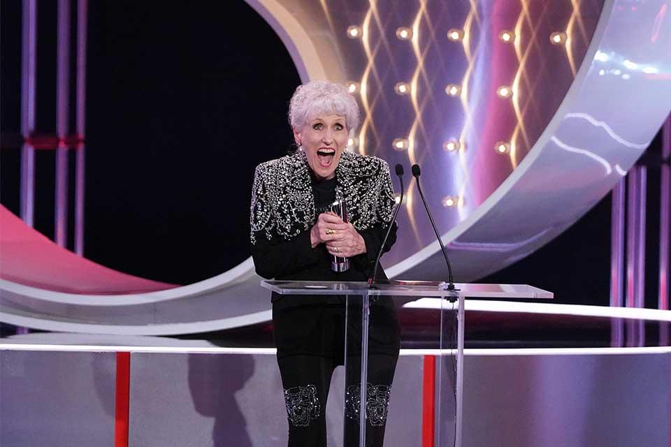 Anita Dobson collecting a British Soap Awards trophy