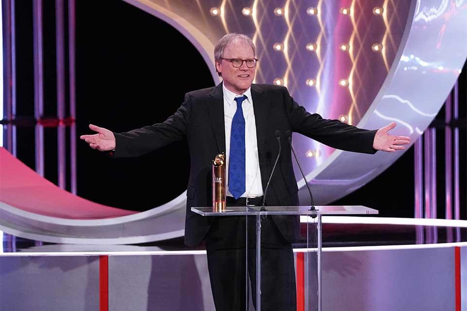 David Neilson collecting a gold British Soap Award